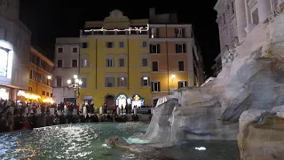 The Trevi fountain at night.
