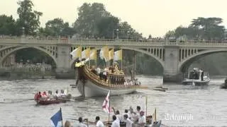 Flame sails down Thames on Gloriana