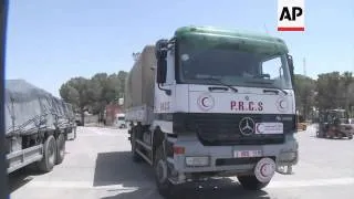 Trucks bring Egyptian aid through Rafah crossing, ambulances enter from Jordan