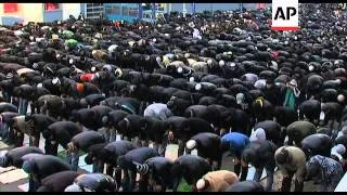 Muslims brave freezing weather to gather for prayers marking Eid