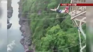 Bungee cord snaps above crocodile-infested waters