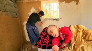 Documentary about the life of a nomadic father and his baby: Plastering the wall of the house