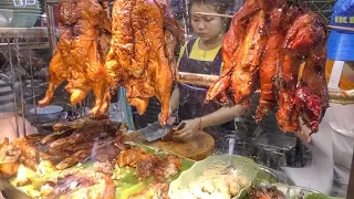 Chinese Street Food in Bangkok, Thailand. Jumbo Lobster, Crispy Pork, Duck, Prawn. Yaowarat Road