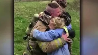 Returning soldier surprises daughters by dressing up like firefighter