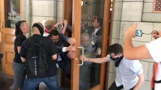 Protesters storm Portland City Hall, guards injured (GRAPHIC LANGUAGE)