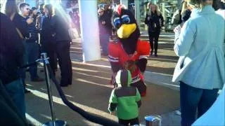 Chicago Blackhawks - Tommy the Hawk dancing with young boy.
