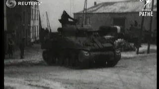 British tanks negotiate slippery roads (1945)