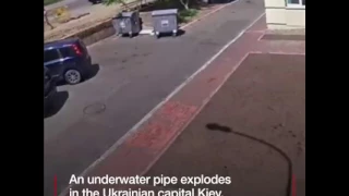 The dramatic moment an underground water pipe in Kiev blows up.