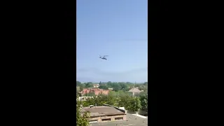 Low-flying Russian Ka-52 attack helicopters firing rockets into the air over Yasynuvata, Ukraine