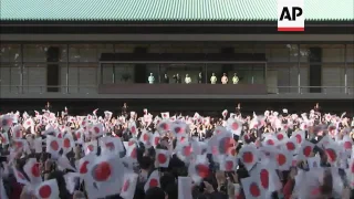 Thousands cheer Japan emperor on his birthday