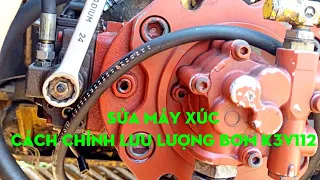 sửa máy xúc chỉnh lưu lượng bơm bít tông k3v112