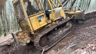 Winching up steep mountain to build a road with John Deere 650g