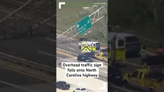 Overhead traffic sign falls onto North Carolina highway