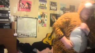 Fat man danceing in a tiger suit lol