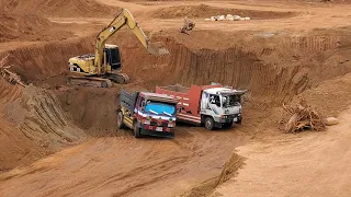 CAT 312 Escarmot came down to cut the ground and put the truck.