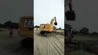 Cat 330 excavator loading trucks