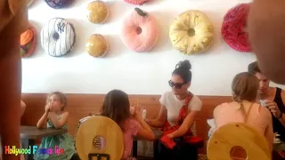 Suri Cruise & Katie Holmes eat donuts in NYC Hollywood Famous Life