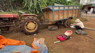 Young Woman Takes on the Challenge of Repairing a Vintage Tractor with Expertise and Passion