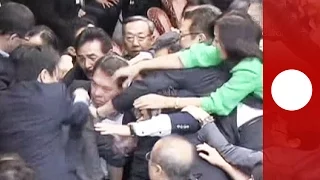 Unusual clashes erupt in Japan parliament over security bills