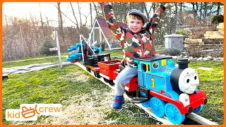 Driving train on backyard railroad to deliver straw and rescue locomotive. Educational | Kid Crew