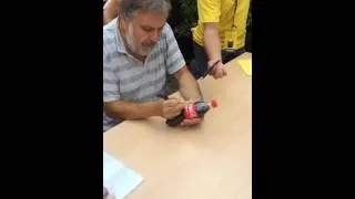 Zizek signing a Coca Cola