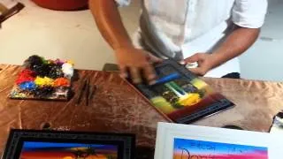 Artist finger painting in Cancun