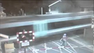 Cyclist Barely Dodges Train (Level Crossing Near-Miss: Cyclist Cheats Death)