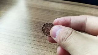 10 cents New Zealand coin stands on a Chinese bullet train