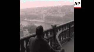 CAN 378 MAN THROWS BOOMERANGS FROM EIFFEL TOWER