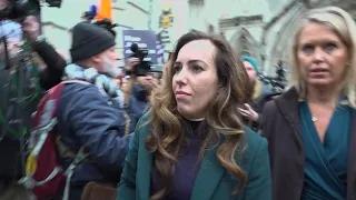 Stella Assange speaks to protesters during the hearing for WikiLeaks founder Assange