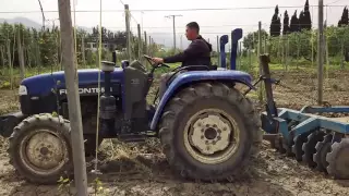 Algeria farmers is driving Lovol tractor working in the field.