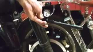 Motorcycle Repair: Adjusting the Rear Suspension Air System Shocks on a Harley Davidson