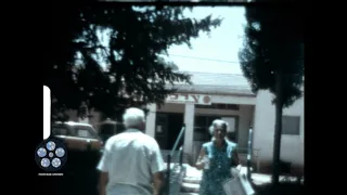 Elderly Couple Outside Market 1972