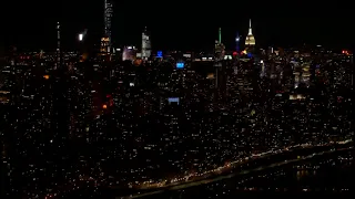 Aerial view of West Side Highway and NYC Skyline at Night