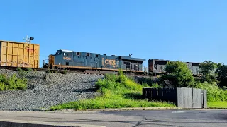 Northbound CSX mixed manifest heading toward Hamilton, Ohio, while Seven-Up photobombs