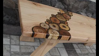 Ash wood bench with fruit trees branches inlay