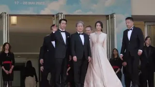 The cast of 'Decision To Leave' gathers at the top of the steps at Cannes Film Festival