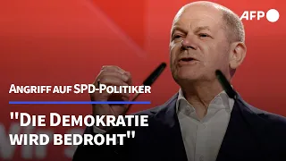 Scholz: "Die Demokratie wird bedroht" | AFP