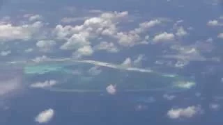 U.S. Navy flies P-8A Poseidon over new islands in South China Sea