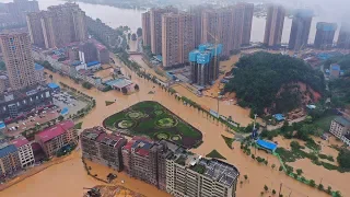 Live: Floods triggered by torrential rains threat parts of China 中国多地遭暴雨洪水袭击