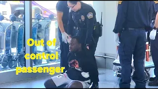 Out of control passenger at TSA Checkpoint LAX airport police take him in custody
