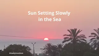 Sun Setting Slowly in the Sea