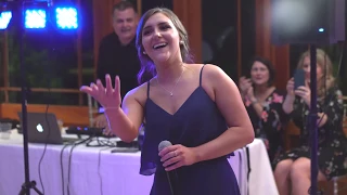 Bridesmaid Leads "Don't Stop Believing" at Wedding