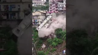 Multi-story building collapses onto other homes