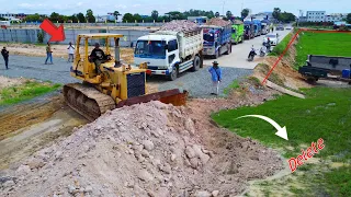 New project!! Huge Landfill by bulldozer D58E Komatsu pushing soil, 5tons truck unloading