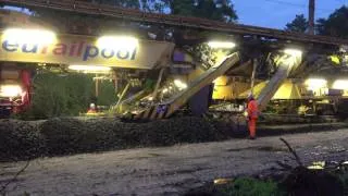 Plasser & Theurer PM 1000 URM Eurailpool in operation during the evening