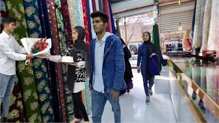 Narges and Khosrow go to the city to buy clothes for Narges