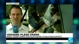 Ukraine MH17 plane crash - rebel leader hands over black boxes