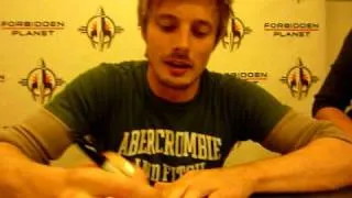 Bradley James at book signing in London with Angel Coulby