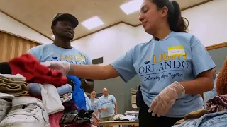 Light Orlando volunteers sort clothes for Central Floridians in need